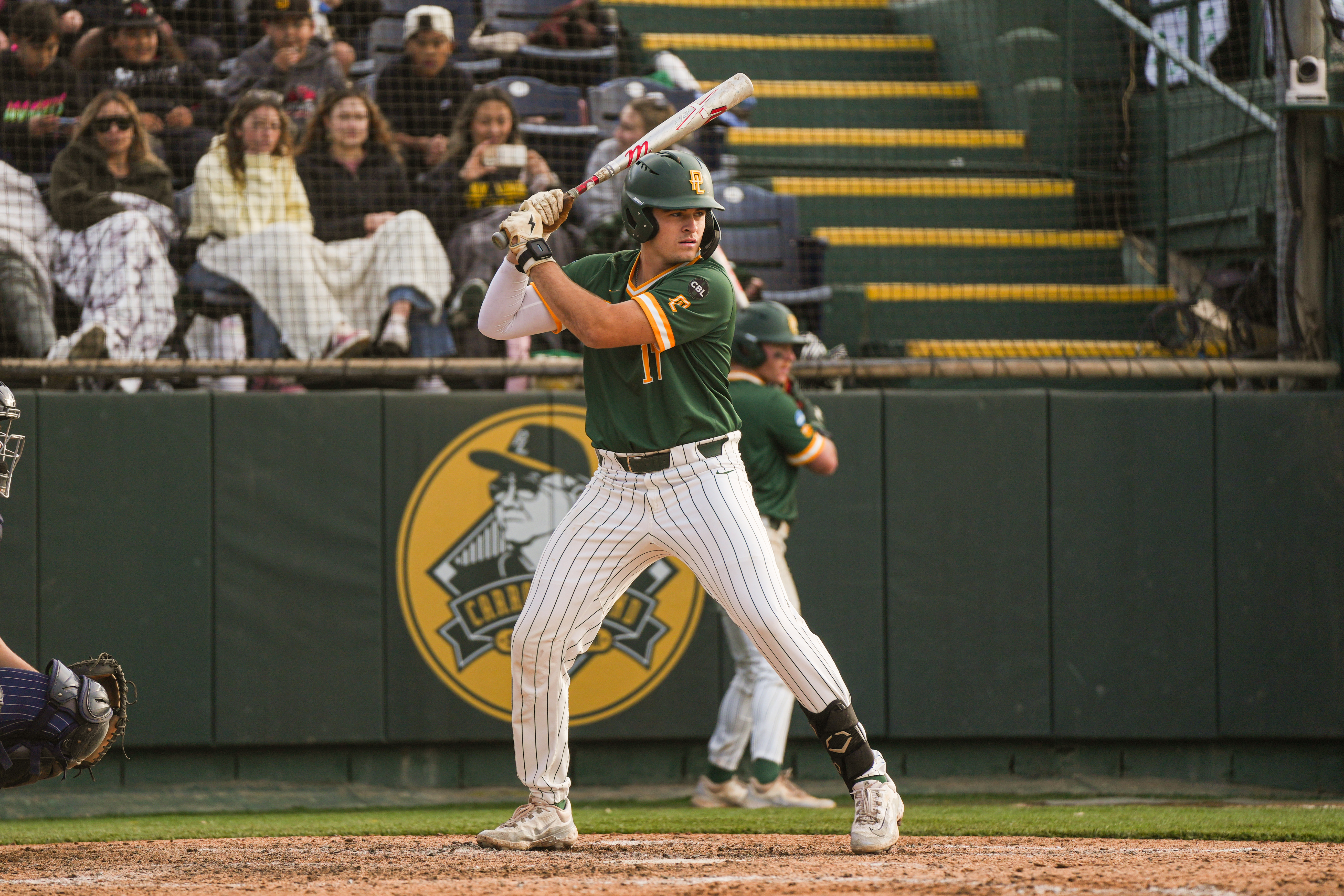  Catcher Jake Entrekin at bat on Feb. 8. Photo courtesy of PLNU SmugMug. Credit to Shannon Hardy. 
