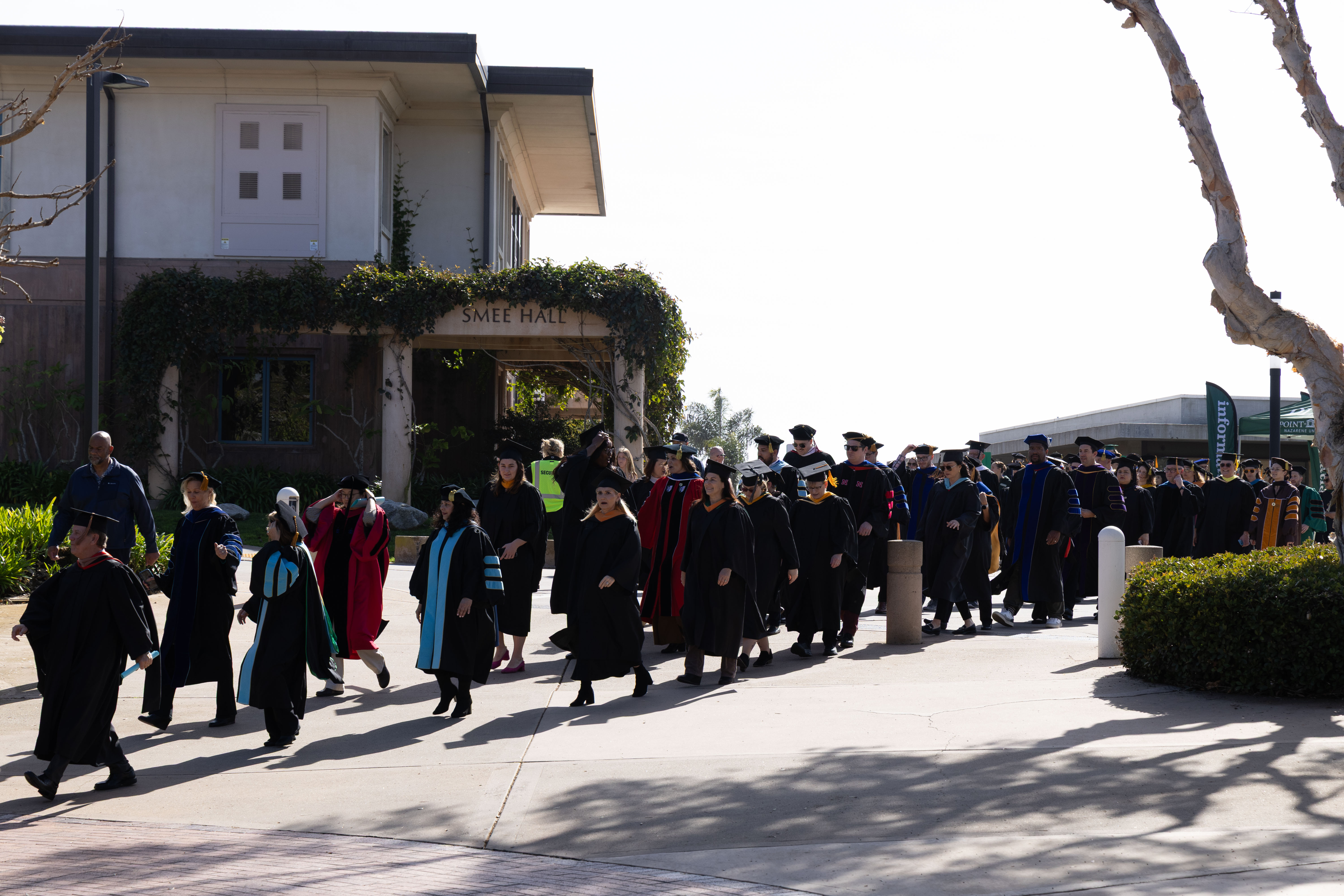  Faculty dressed in regalia walking into Brown Chapel. Photo credit to Charis Johnston.
