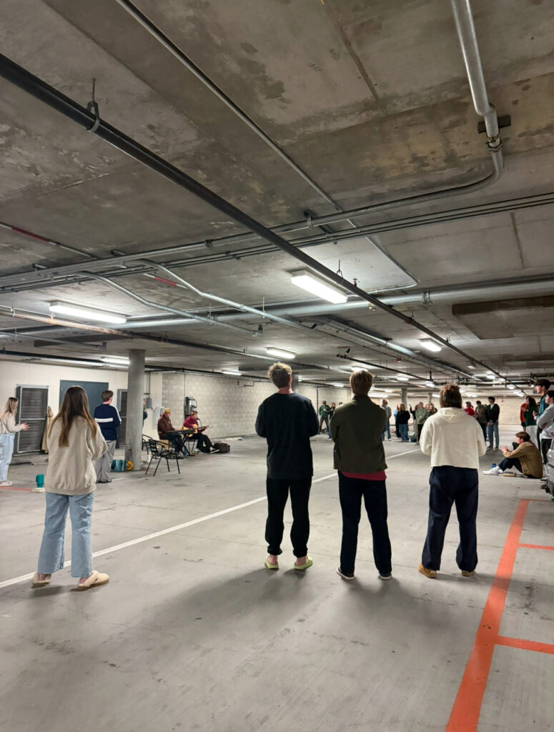 Students worshipping in the Fermanian parking garage on a Tuesday evening. Photo credit to Riley Carter.

