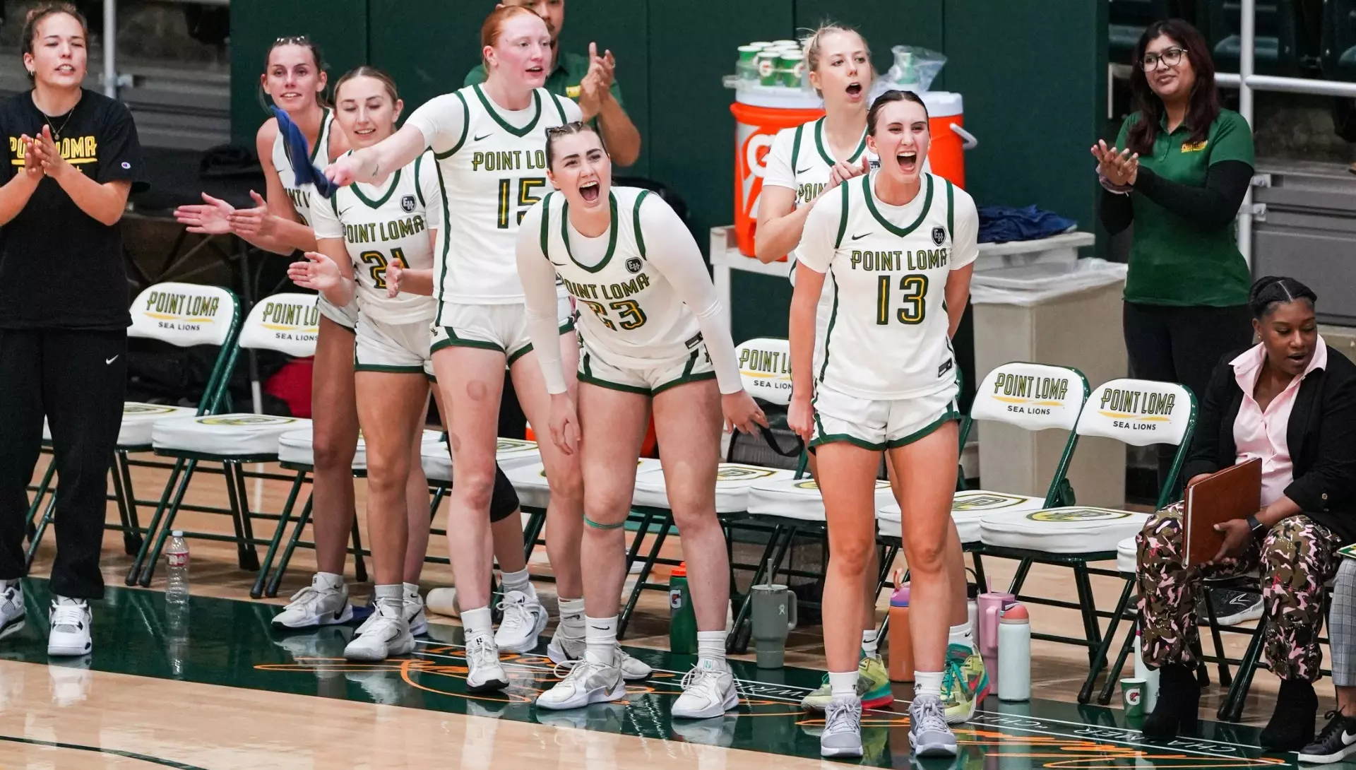 PLNU women's basketball celebrating as they defeat Menlo on Feb. 27. Photo courtesy of PLNU SmugMug and credit to Shannon Hardy.